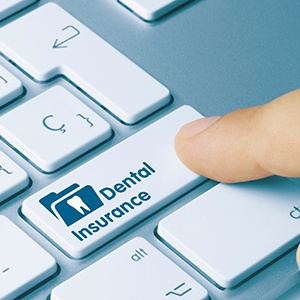Pressing key on keyboard that says “Dental Insurance”