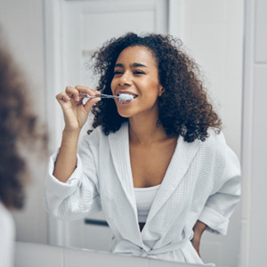San Jose patient gently brushing teeth 