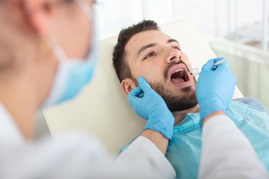 A man getting a dental check-up near Santa Clara